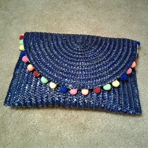 Navy straw clutch bag